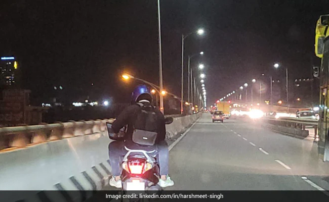 Pillion Rider Spotted Using Laptop On A Busy Flyover